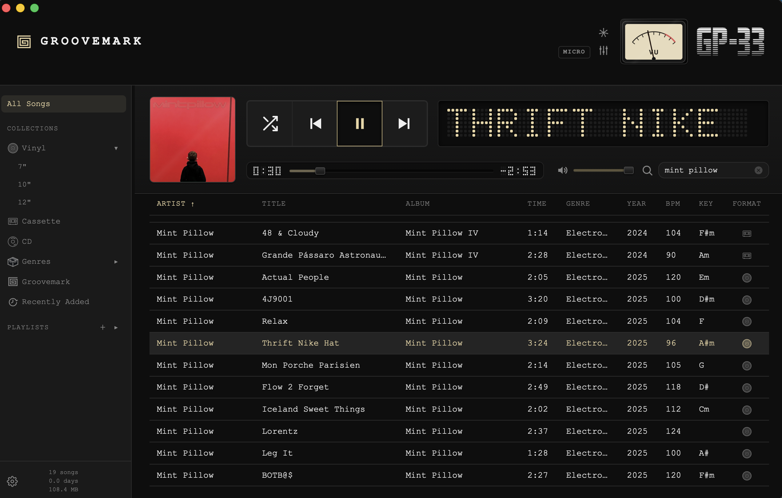 GP-33's full player: an album playing, the library below it with BPM, key and format columns